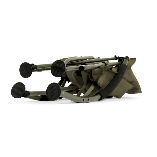 A folded olive green camping chair with black textured foot pads and a black carrying strap, shown on a plain white background.
