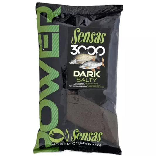 A bag of Sensas 3000 Dark Salty fishing bait, featuring a black and green packaging design with a clear window showing the dark brown bait inside.